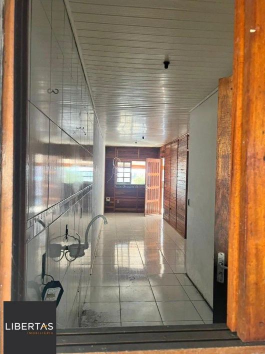 Terreno de 392m² com casa mista de 82m²