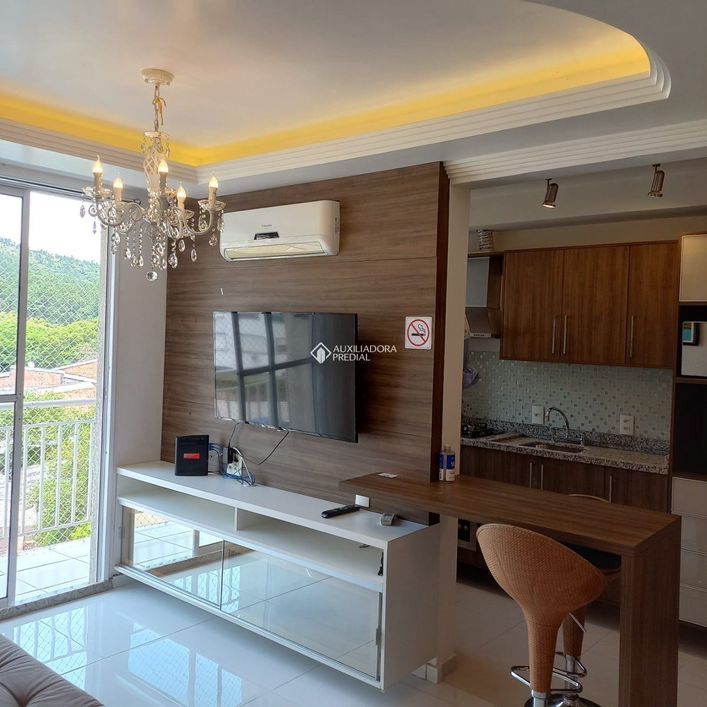 Apartamento de dois dormitórios mobiliado. (Canto dos Pássaros)