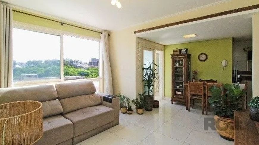 Apartamento com 2 dormitórios, living para 2 ambientes, cozinha americana, área de serviço, dependên