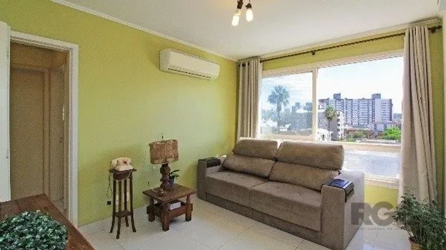 Apartamento com 2 dormitórios, living para 2 ambientes, cozinha americana, área de serviço, dependên