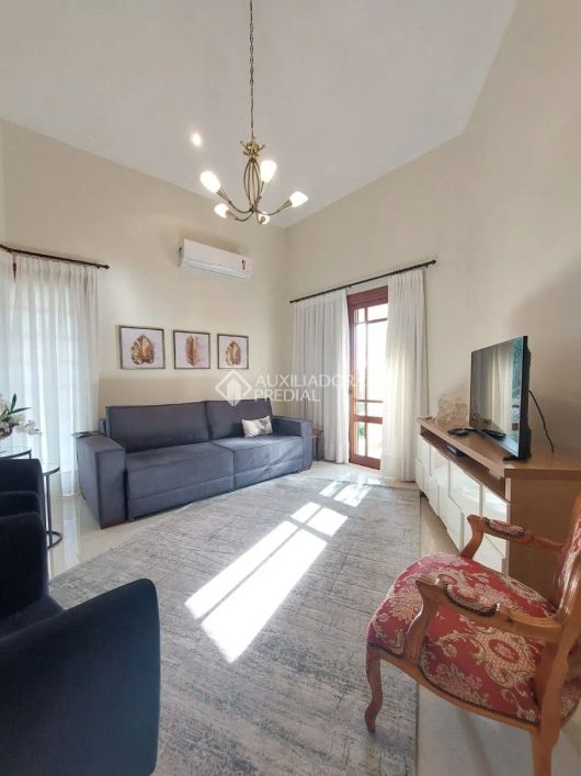 Casa de condomínio à venda no bairro Nonoai com 478 m² e 3 dormitórios/quartos.