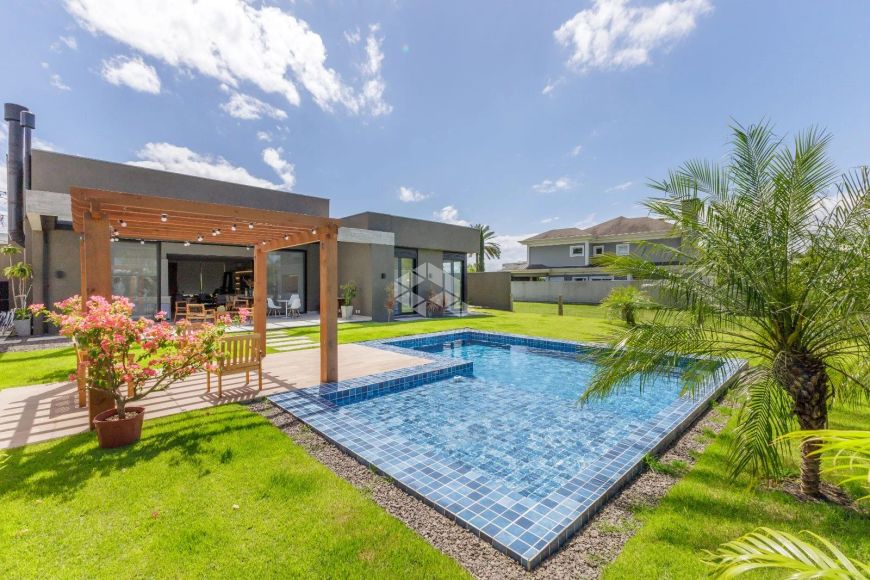 Casa térrea com 3 suítes e vista para o lago no Terraville em Porto Alegre.