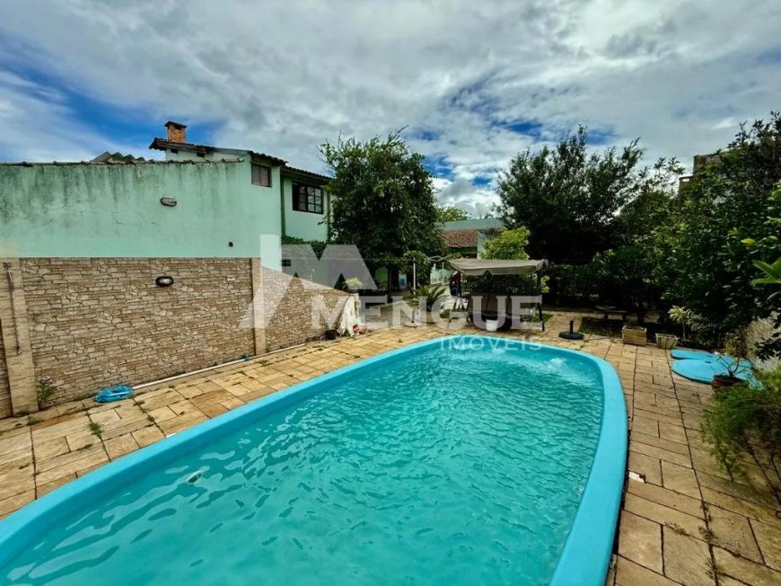 Casa residencial com 4 dormitórios e 5 vagas à venda no bairro Sarandi em Porto Alegre com 356m² por