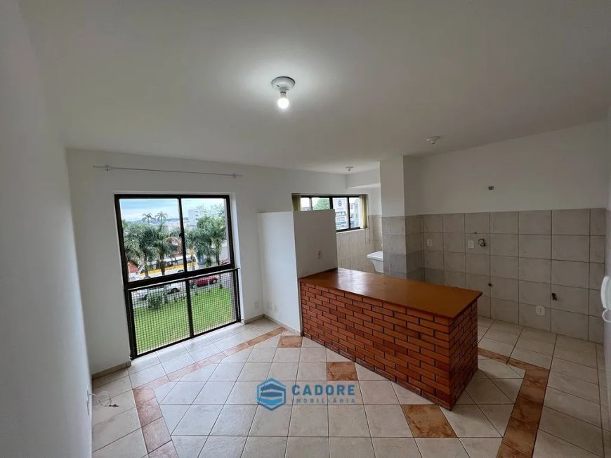 Apartamento um dormitório elevador e garagem