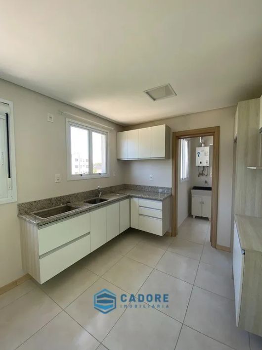 Apartamento dois dormitórios com suite e garagem